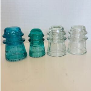 Hemingray Insulators Clear 16 and 17, Blue Green 9, Blue Green 16 (damage)